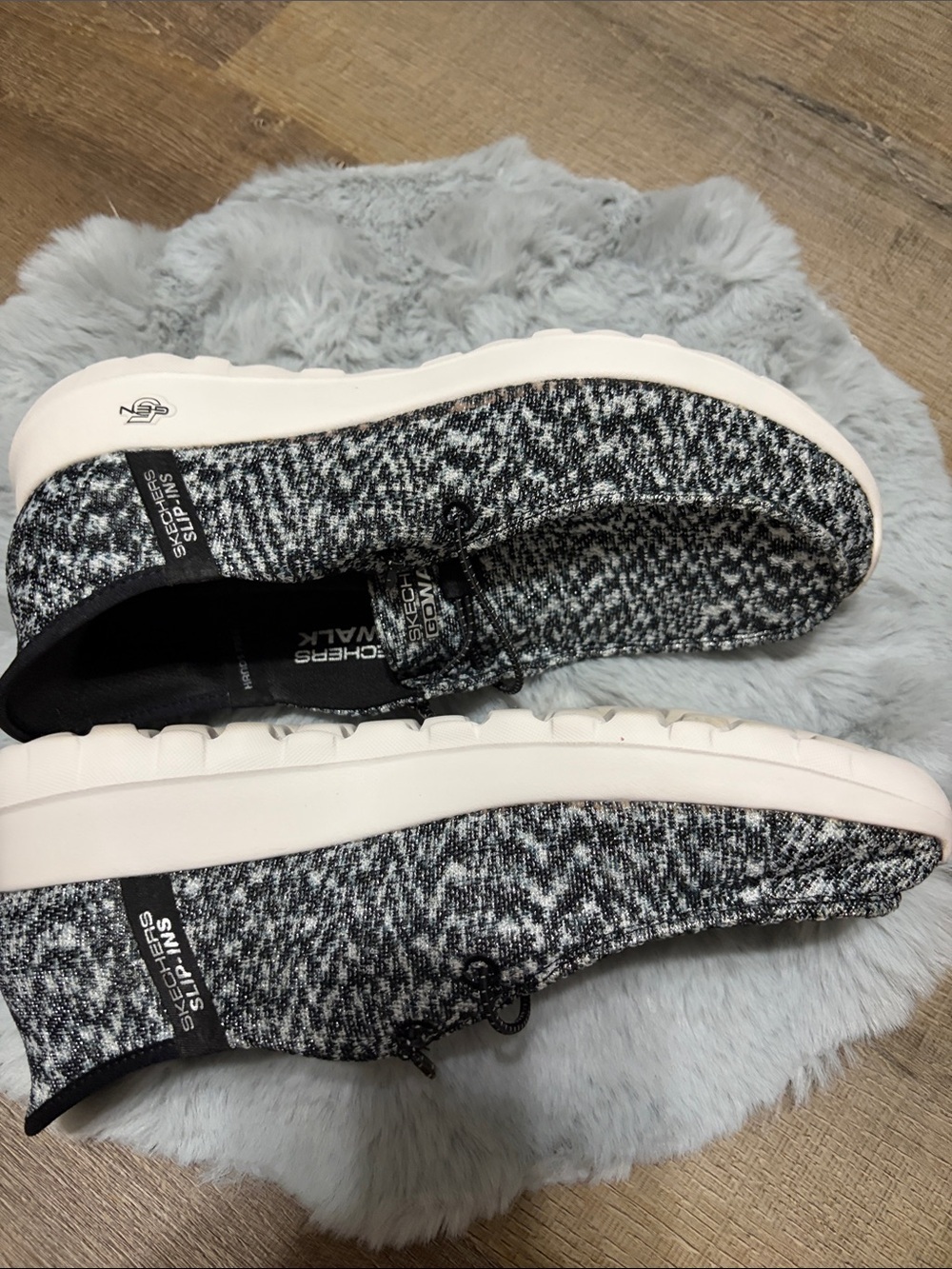 Skechers GO WALK Slip-ins featuring a black and white heathered knit upper. - Picture 5 of 8